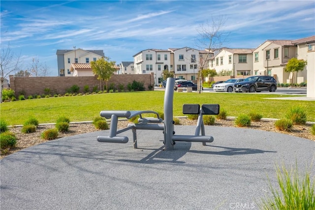 view of home's community with a lawn