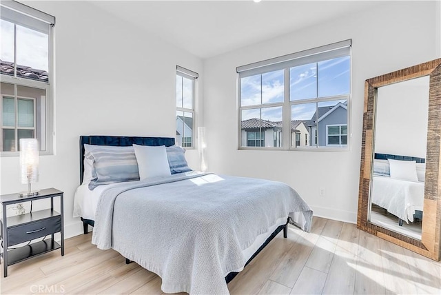 bedroom with light hardwood / wood-style floors