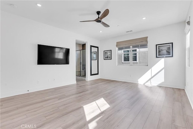 unfurnished living room with ceiling fan and light hardwood / wood-style floors