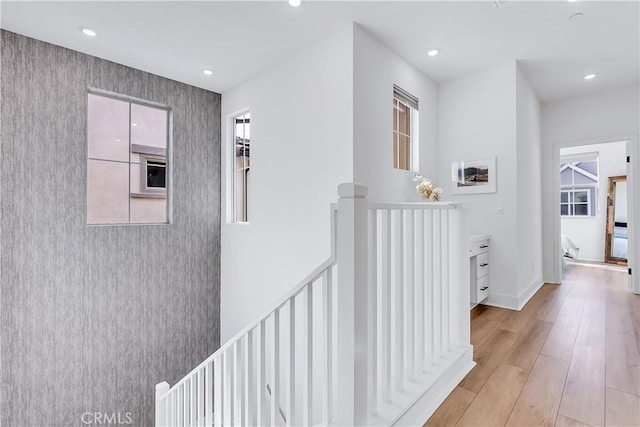 corridor with light hardwood / wood-style flooring