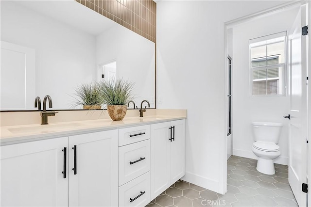 full bathroom with vanity,  shower combination, tile patterned floors, and toilet