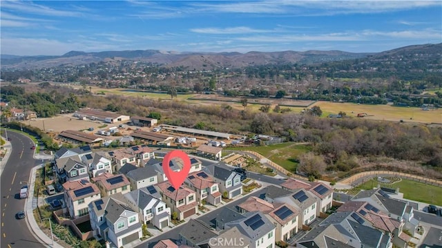 birds eye view of property featuring a mountain view