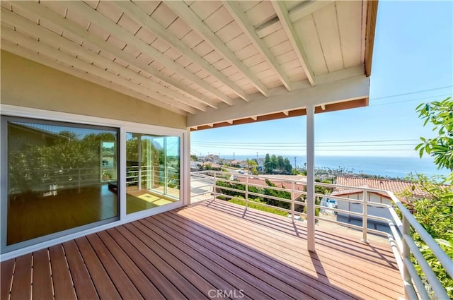 wooden terrace with a water view