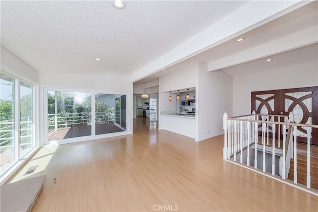 interior space with lofted ceiling with beams, sink, and french doors