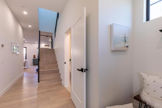 stairs with hardwood / wood-style floors