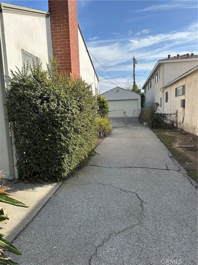 view of property exterior with an outbuilding and a garage