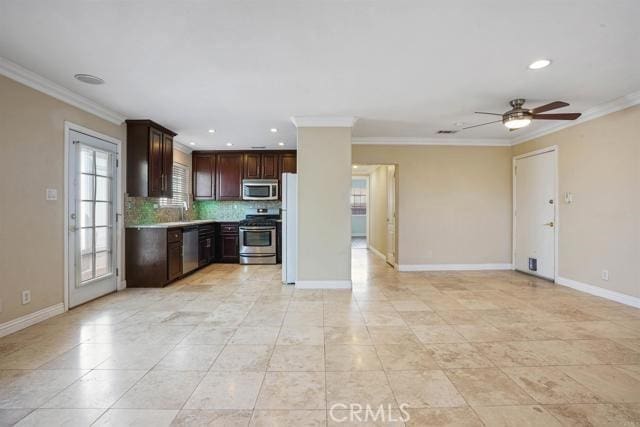 kitchen with appliances with stainless steel finishes, backsplash, ceiling fan, dark brown cabinetry, and crown molding