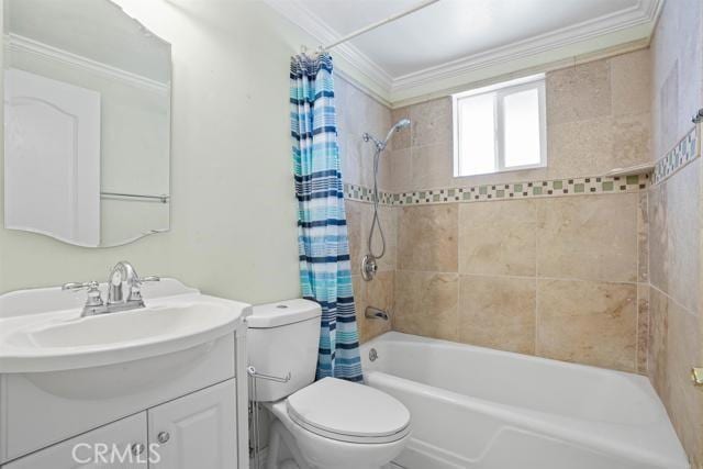 full bathroom featuring crown molding, vanity, shower / bath combination with curtain, and toilet