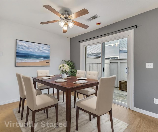 dining room featuring ceiling fan and light wood-type flooring