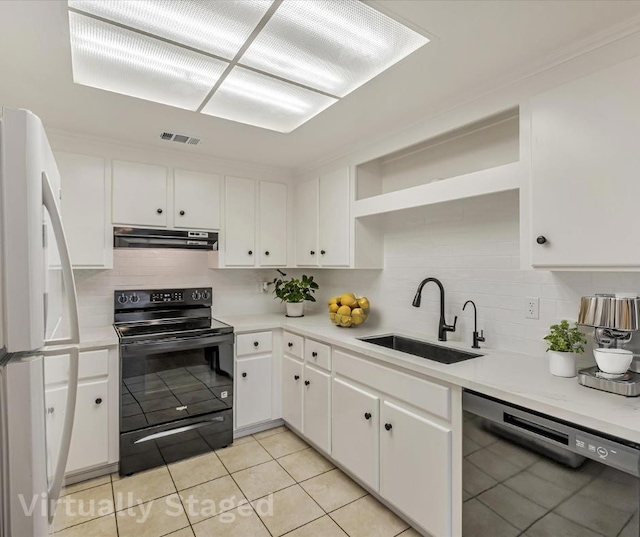 kitchen with sink, black appliances, ventilation hood, white cabinets, and backsplash