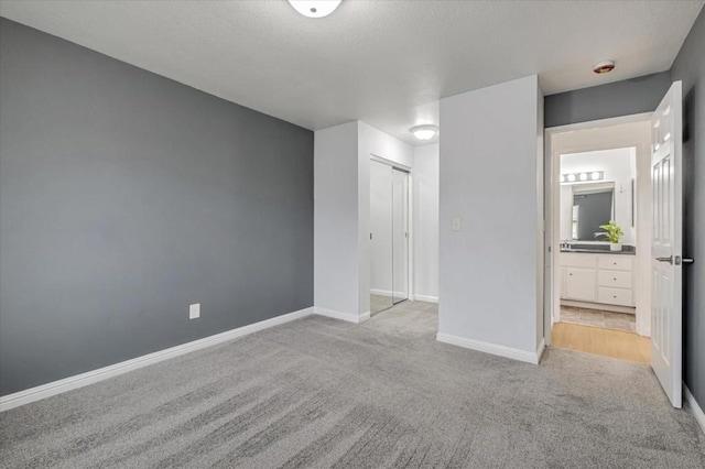 interior space with light colored carpet and a closet