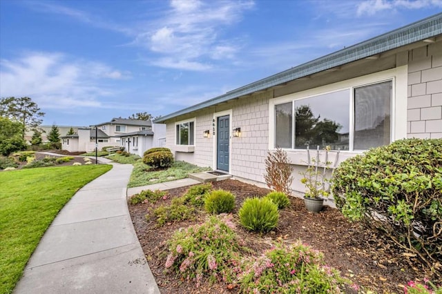 entrance to property with a yard