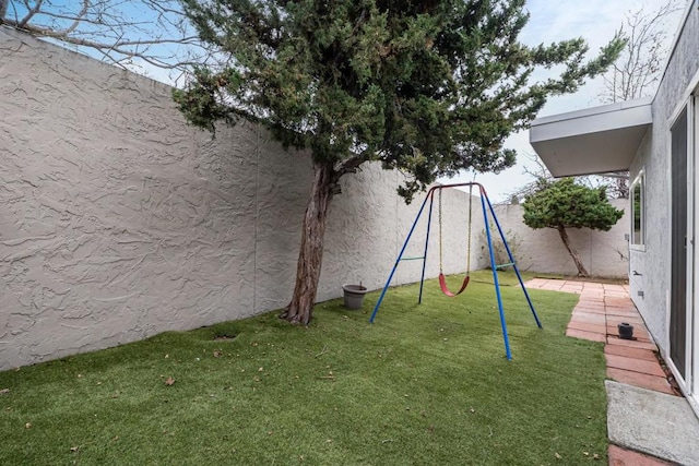 view of play area featuring a lawn