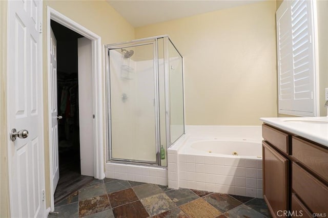 bathroom featuring vanity and plus walk in shower