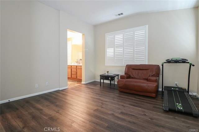 living area with dark hardwood / wood-style flooring