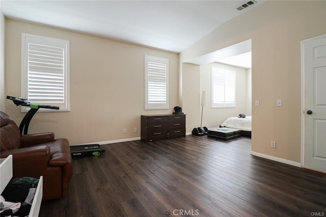 sitting room with dark wood-type flooring