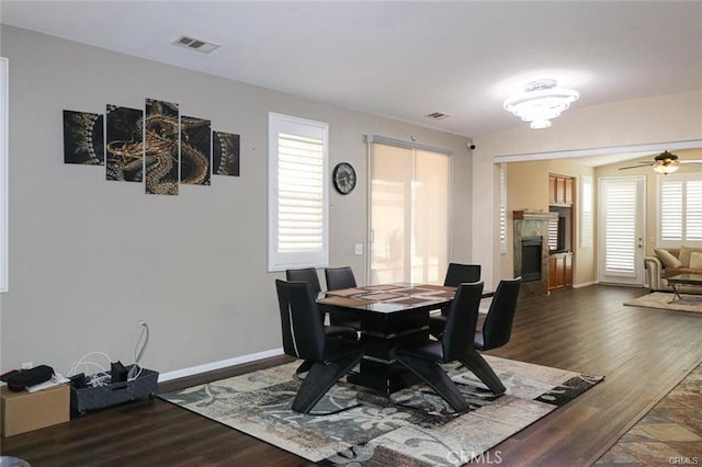 dining space with dark wood-type flooring