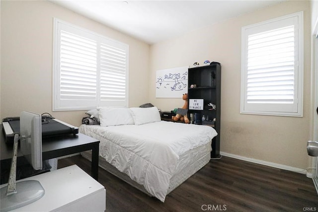 bedroom featuring dark hardwood / wood-style flooring