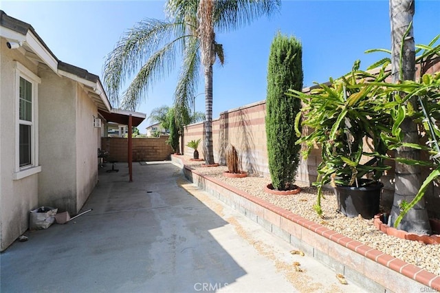 view of side of home featuring a patio area