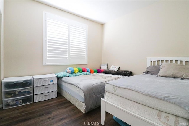 bedroom featuring dark wood-type flooring