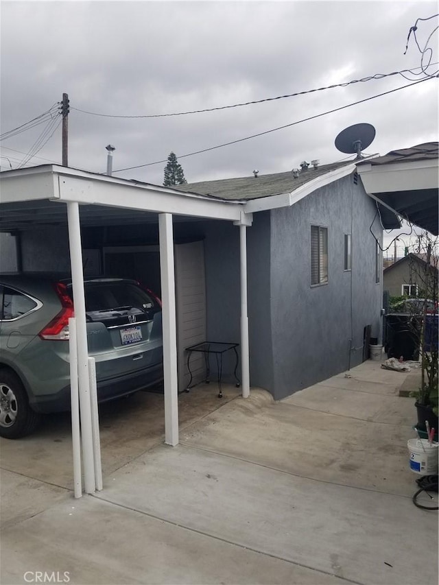 garage featuring a carport