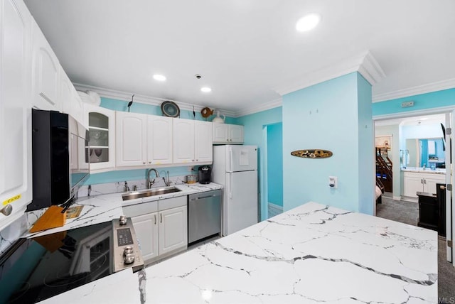 kitchen with white cabinetry, white refrigerator, dishwasher, and sink