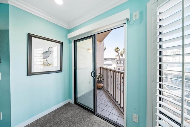 entryway with a healthy amount of sunlight, ornamental molding, and carpet flooring