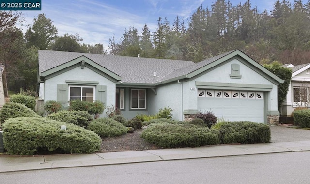 ranch-style home featuring a garage