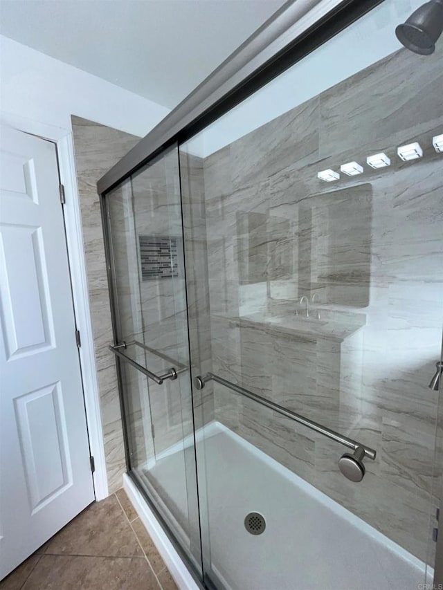 bathroom featuring a stall shower and tile patterned floors