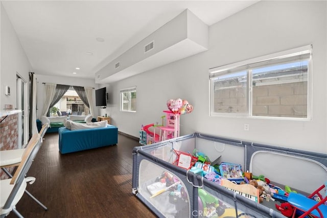 interior space featuring visible vents and wood finished floors