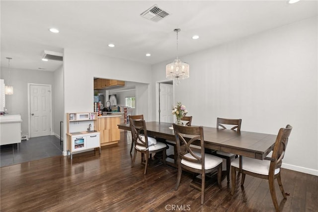 dining room with visible vents, baseboards, recessed lighting, dark wood-style floors, and a notable chandelier