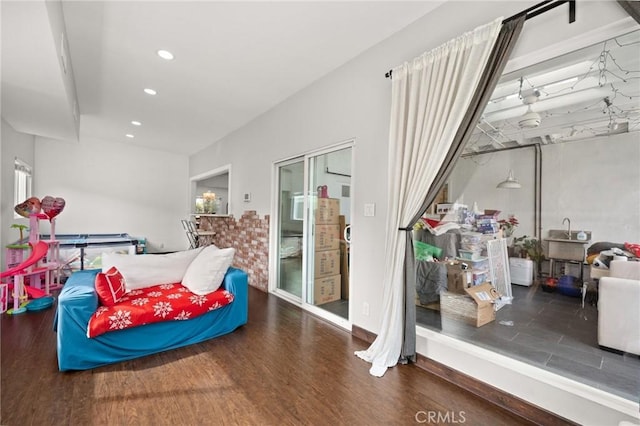 bedroom with dark wood-type flooring