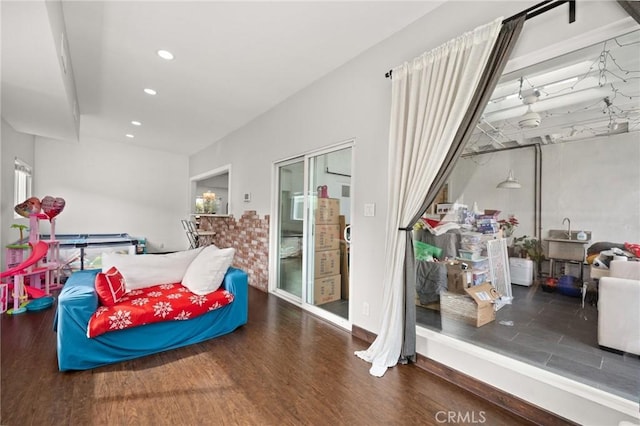 living area with recessed lighting and wood finished floors