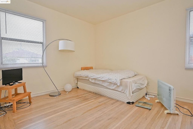 bedroom with wood-type flooring