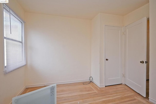 laundry area featuring light hardwood / wood-style flooring