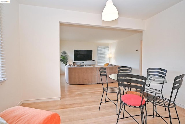 dining area with light hardwood / wood-style flooring