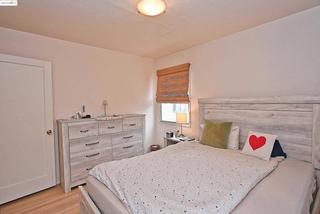 bedroom with light hardwood / wood-style flooring