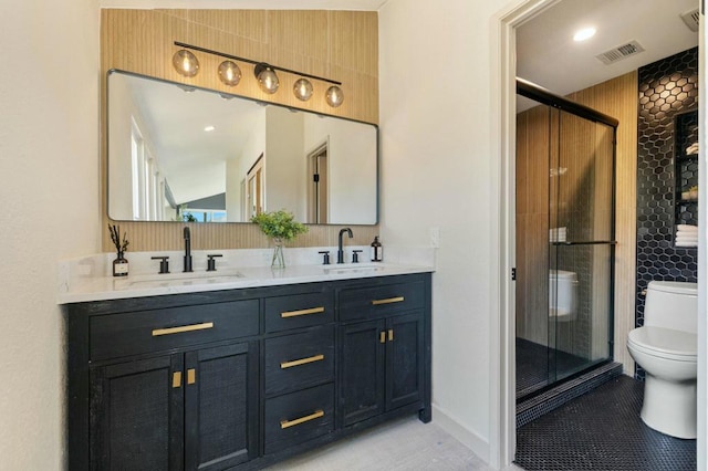 bathroom with vanity, an enclosed shower, tile patterned floors, and toilet