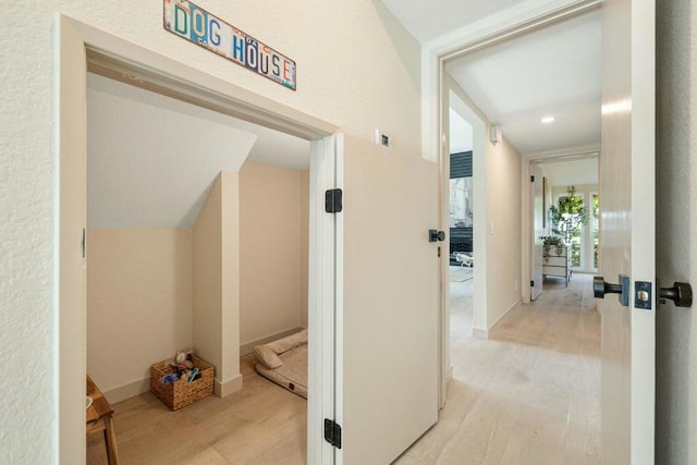 hallway with light wood-type flooring