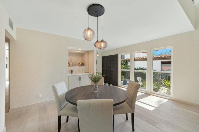 dining space featuring light hardwood / wood-style flooring