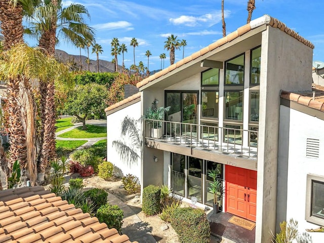 view of property exterior with a balcony