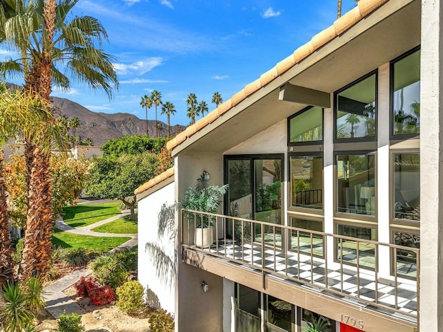 view of home's exterior with a mountain view