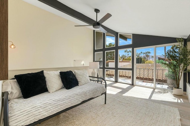 living room with beamed ceiling, ceiling fan, and high vaulted ceiling