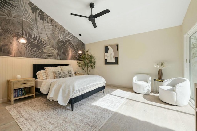 bedroom featuring vaulted ceiling, wood-type flooring, and ceiling fan