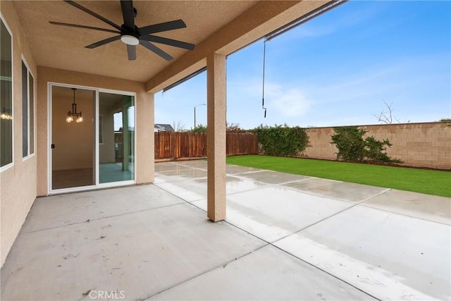 view of patio featuring a fenced backyard and ceiling fan