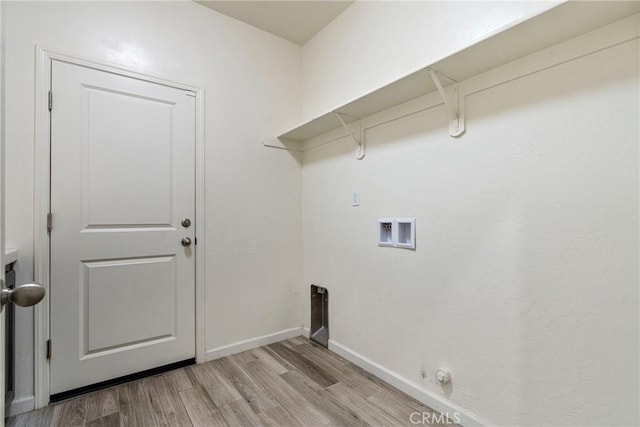 laundry area with hookup for a washing machine, light wood-style flooring, gas dryer hookup, laundry area, and baseboards