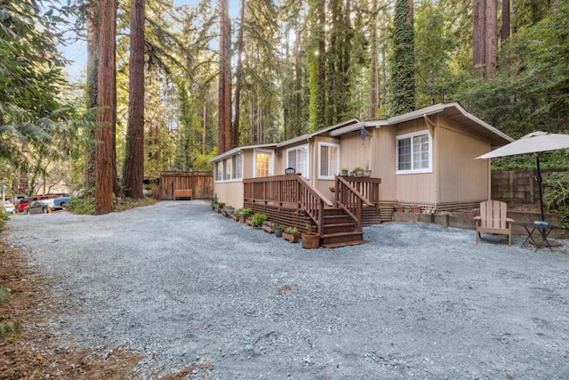 view of front of property featuring a wooden deck