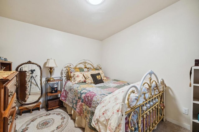 bedroom with light colored carpet