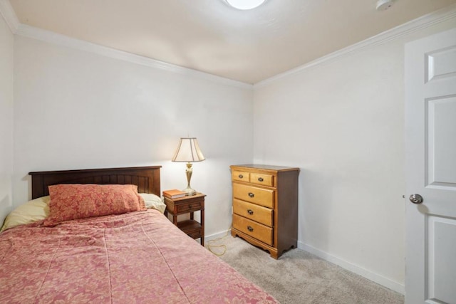 bedroom with crown molding and light carpet