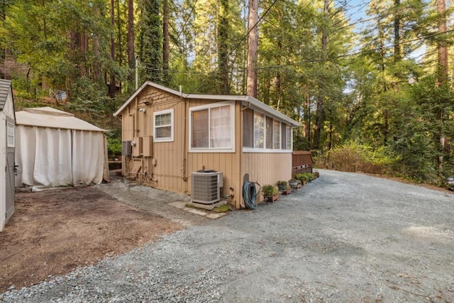 view of outbuilding featuring central AC unit